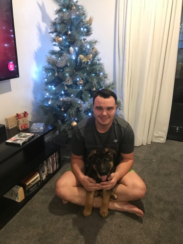 Dom and Wolfie by the Christmas tree.